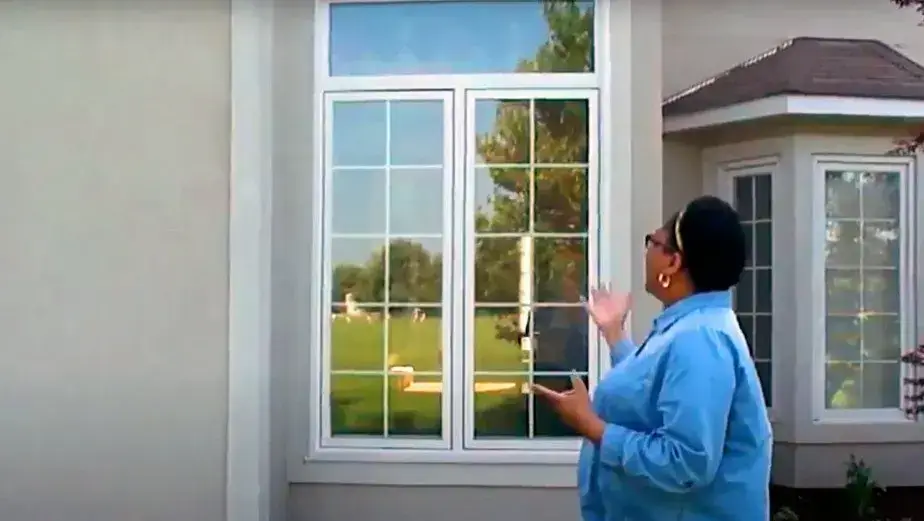 Homeowner Shows Her New Windows Installed by Opal Enterprises in Naperville