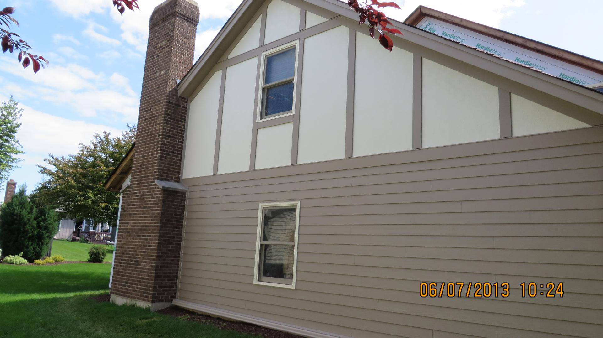 Sail Cloth Hardie Stucco paired with Khaki Brown Trim & Lap Siding in