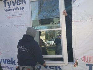 opal workers installing new energy-efficient windows