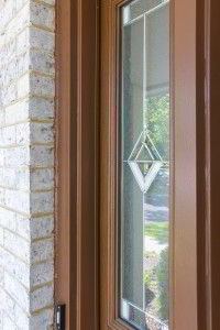 Decorative glasswork on sidelites of ProVia door on a home in Geneva.