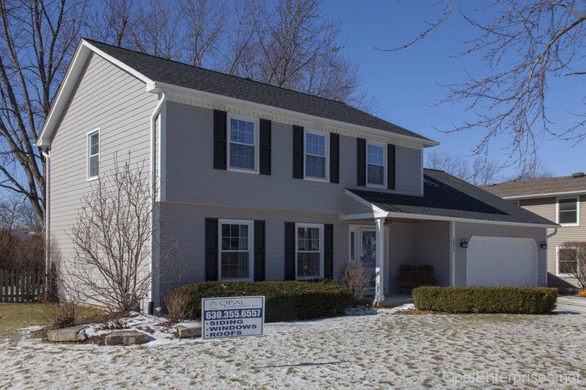 Exterior home renovation in Naperville with James Hardie Pearl Gray siding Opal Enterprises
