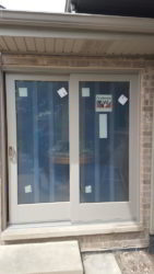 Here's a newly installed Andersen patio door. It's a 400 Series gliding door with a Canvas color exterior and a wood interior.