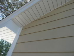 Here's a close up of a James Hardie siding installation in Lombard, IL. This is the Autumn Tan color paired with Arctic White soffit and trim.
