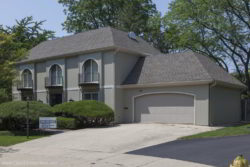 This is a unique home where we installed James Hardie vertical siding and Andersen Windows in Glen Ellyn, IL.