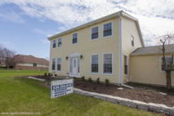 Complete home renovation with new roof, windows, and siding in Homer Glen Illinois by Opal Enterprises.