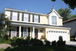 A cheerful upgrade in Lombard Illinois! This home is outfitted with Woodland Cream James Hardie siding, GAF roofing, new shutters, and accents.