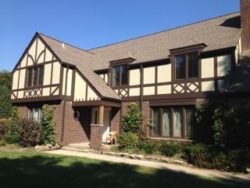 We created an old world style with modern materials using Hardie stucco panels and decorative trim work.