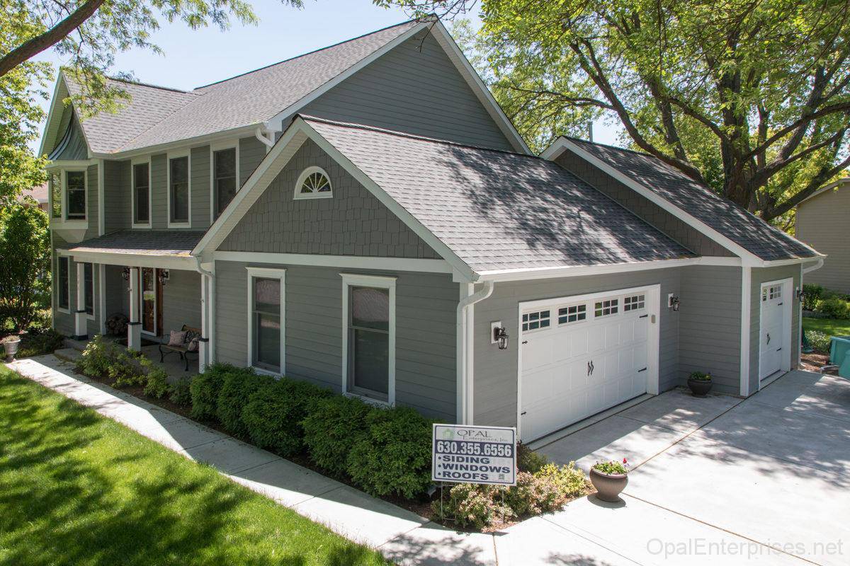 Improved home exterior after new roofing and siding in Naperville.