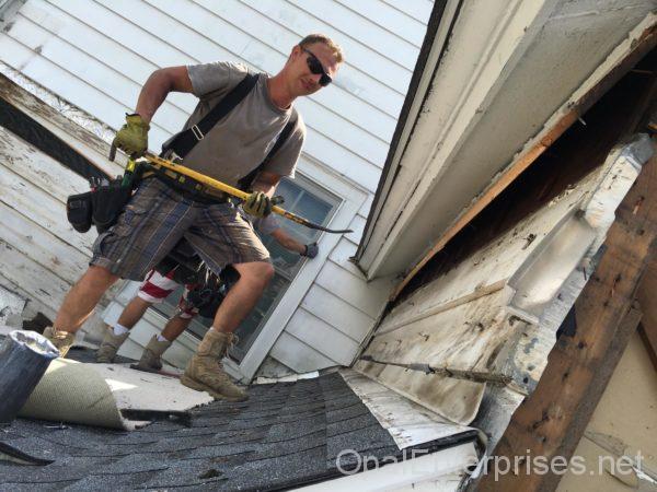 One of the skilled craftsman at Opal Enterprises replacing siding in Clarendon Hills