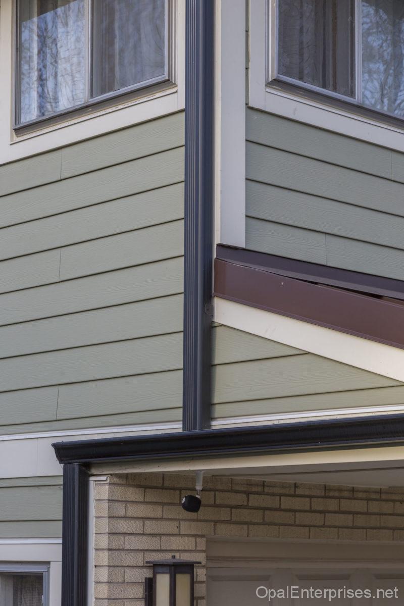 Angle detail of siding, trim, and windows