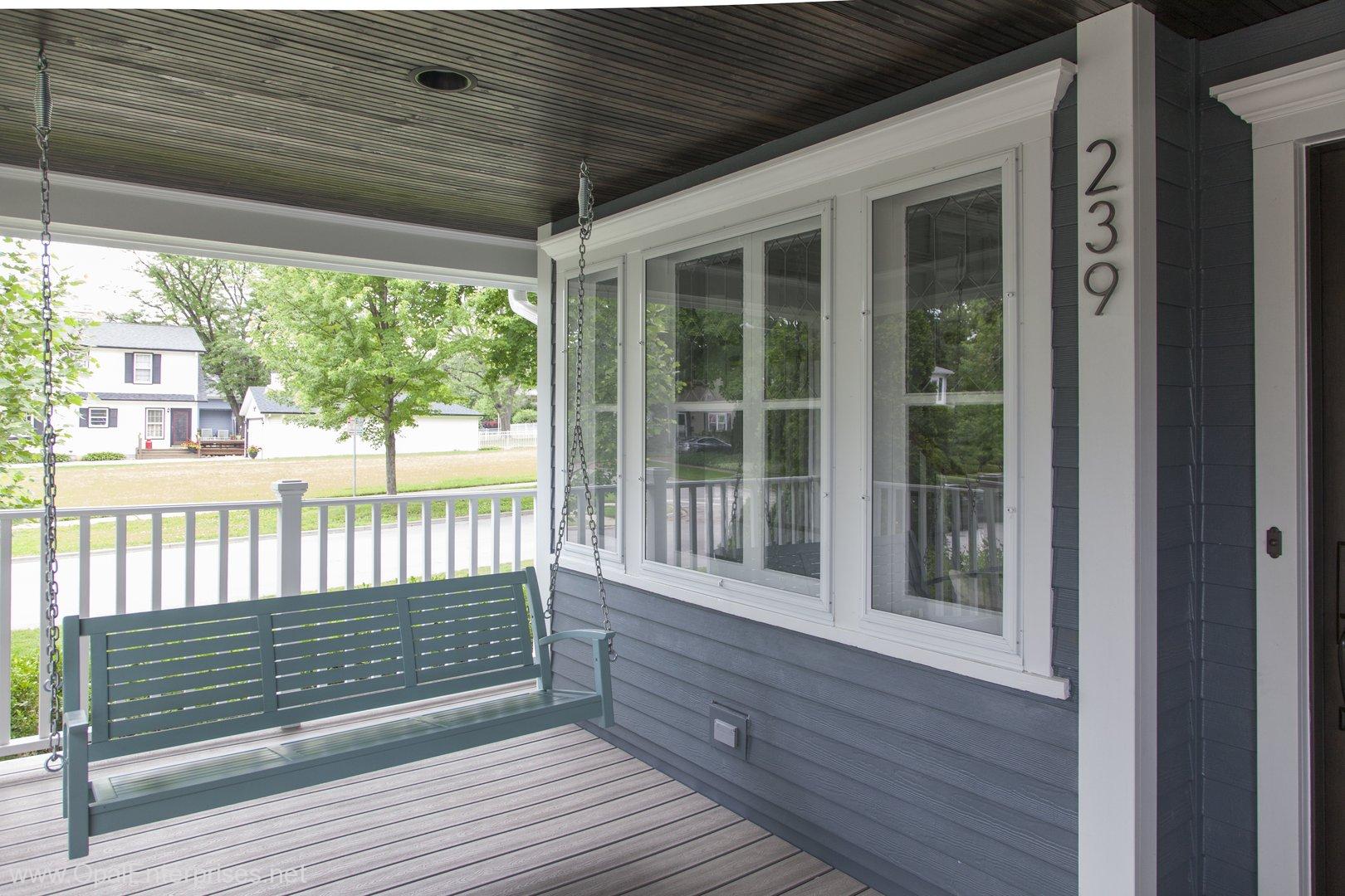 recently remodeled front porch with porch swing