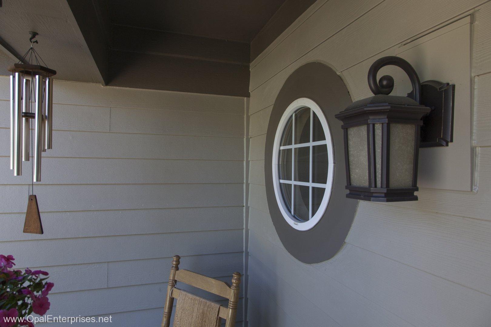 Circle Window in front porch #OpalCurbAppeal