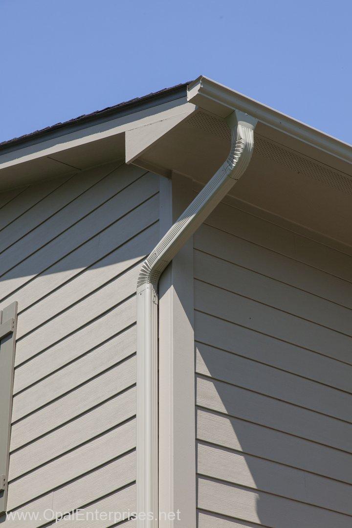Khaki Brown Hardie Board Siding with matching gutters & soffit