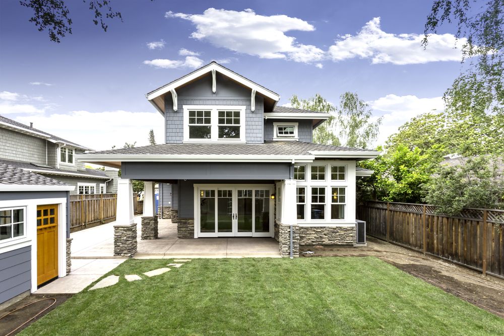 two-story house with powder blue vinyl siding