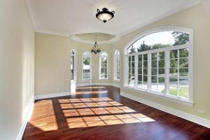 sunlight beaming through dining room windows in new home