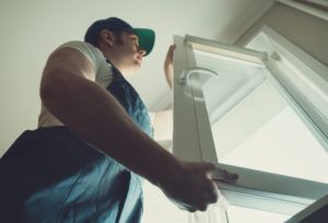 technician installs-new-basement-window