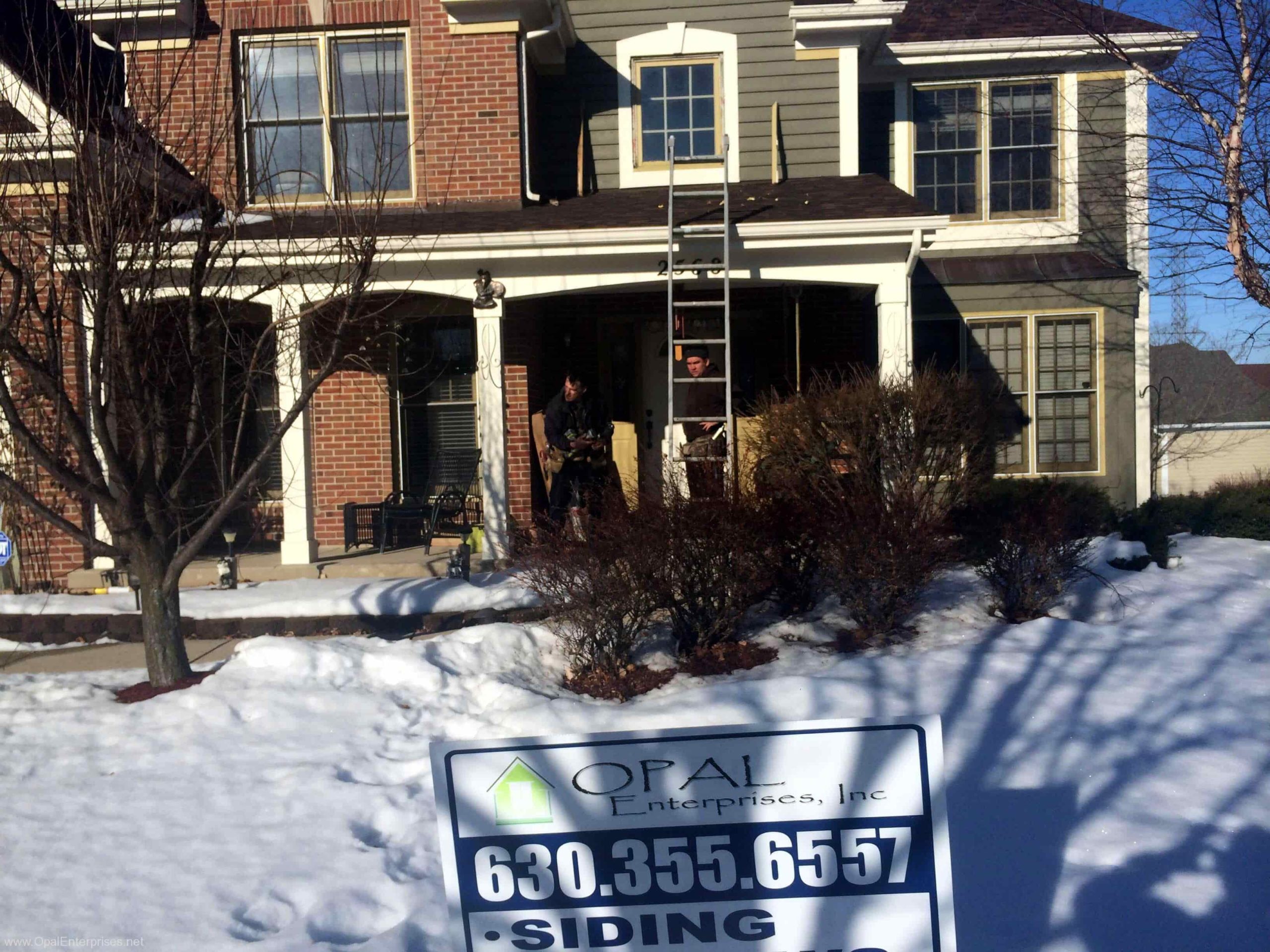 Hard at work, installing new Andersen A-Series Windows