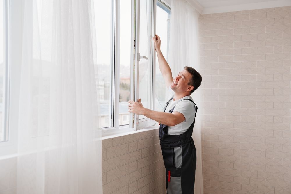 Installer placing a sliding window in a Naperville home opening
