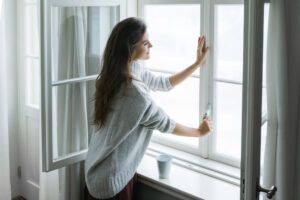 Woman Opening Her Windows